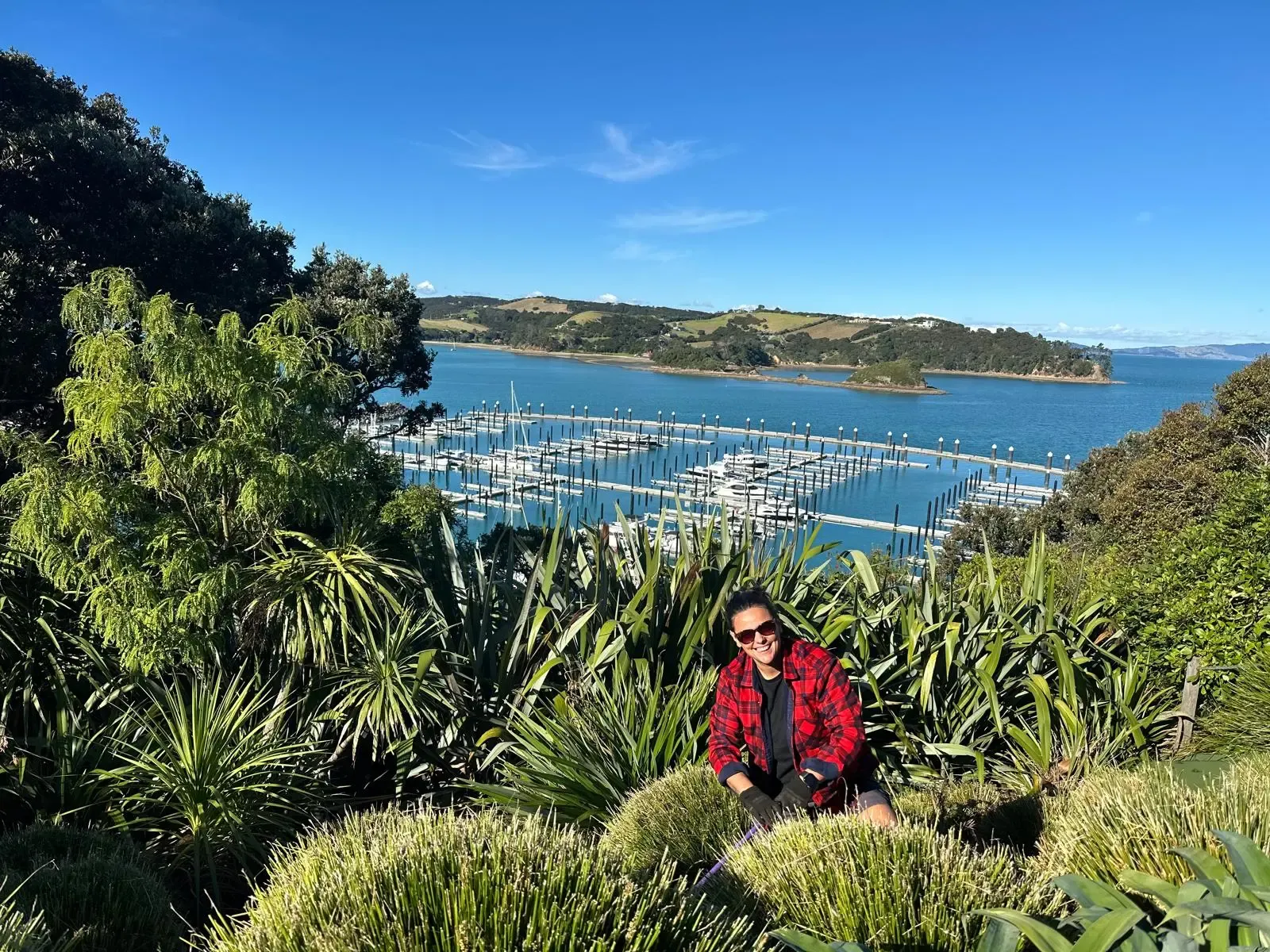 Life Gardening member sitting in a coastal garden in Waiheke